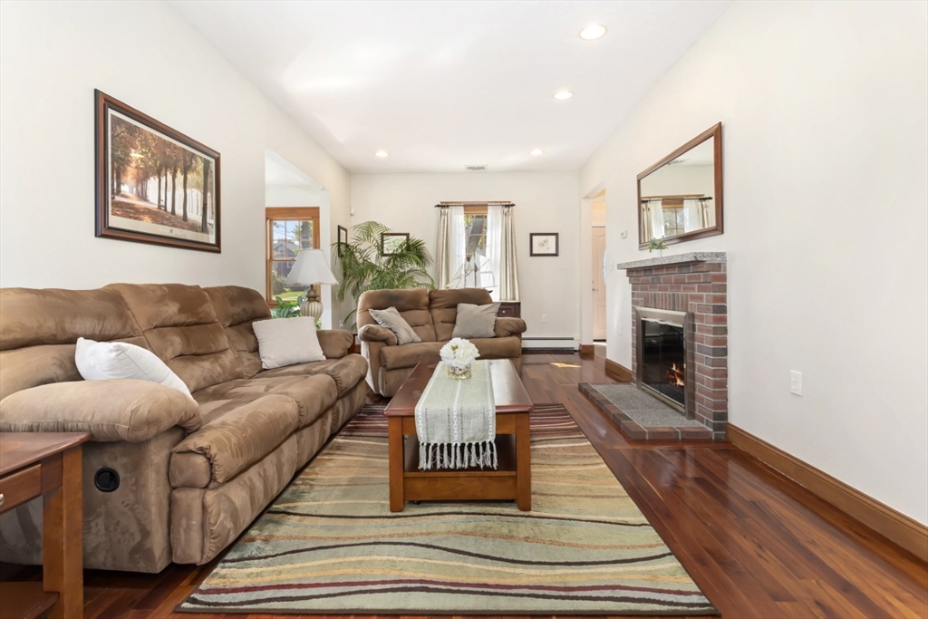 80 Squanto Road Quincy, MA 02169 - Photo 8 of 42 a living room with furniture and a fireplace