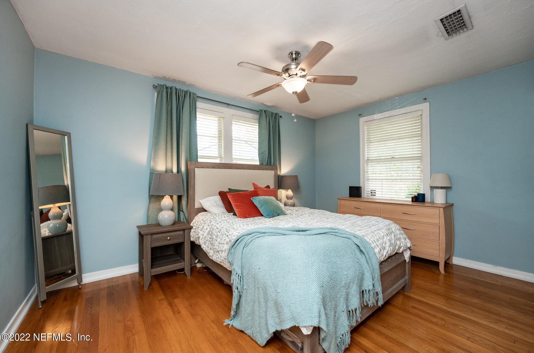 4068 London Road Jacksonville, FL 32207 - Photo 13 of 29 a bedroom with a bed and a chandelier