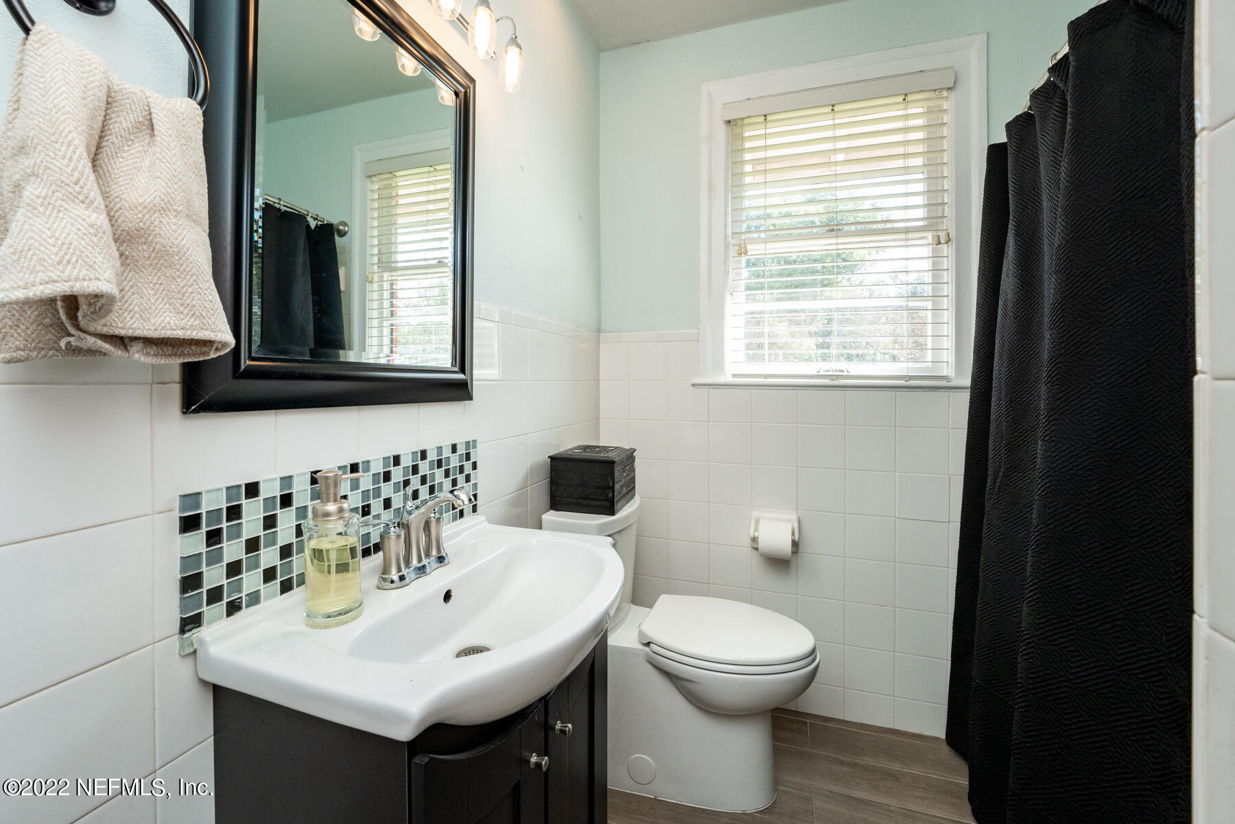 4068 London Road Jacksonville, FL 32207 - Photo 16 of 29 a bathroom with a sink and a toilet