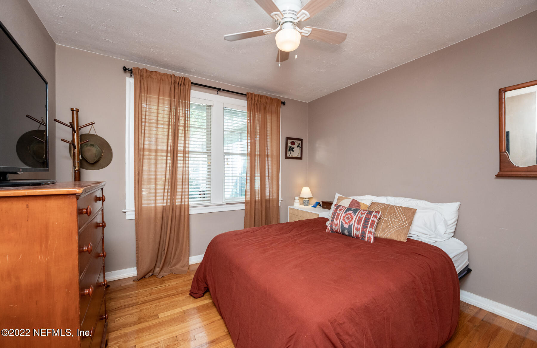 4068 London Road Jacksonville, FL 32207 - Photo 17 of 29 a bedroom with a bed and cabinets