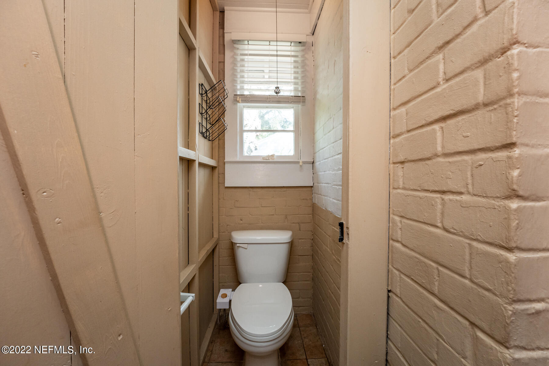 4068 London Road Jacksonville, FL 32207 - Photo 21 of 29 a bathroom with a toilet and a sink