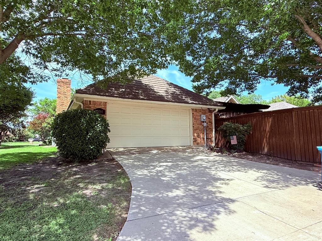3014 Pecan Ridge Drive Rowlett, TX 75088 - Photo 29 of 29 a view of a house with a small yard and a large tree