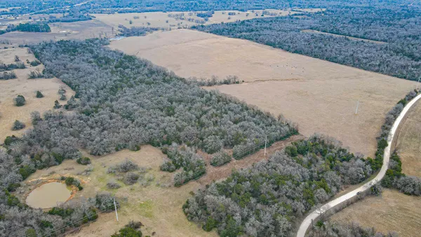 a aerial view of a house with a yard