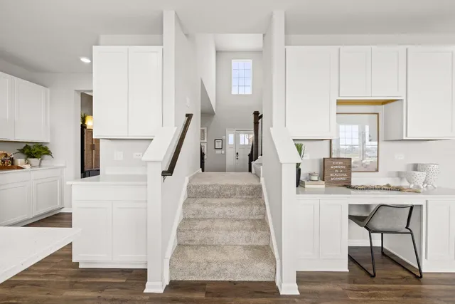 a view of entryway and hall with wooden floor