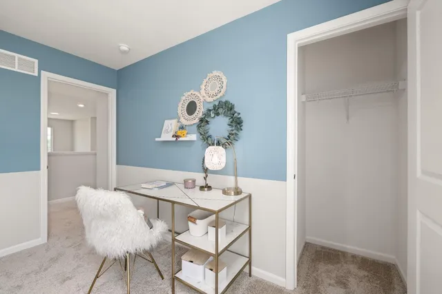 a dining room with a sink and chandelier