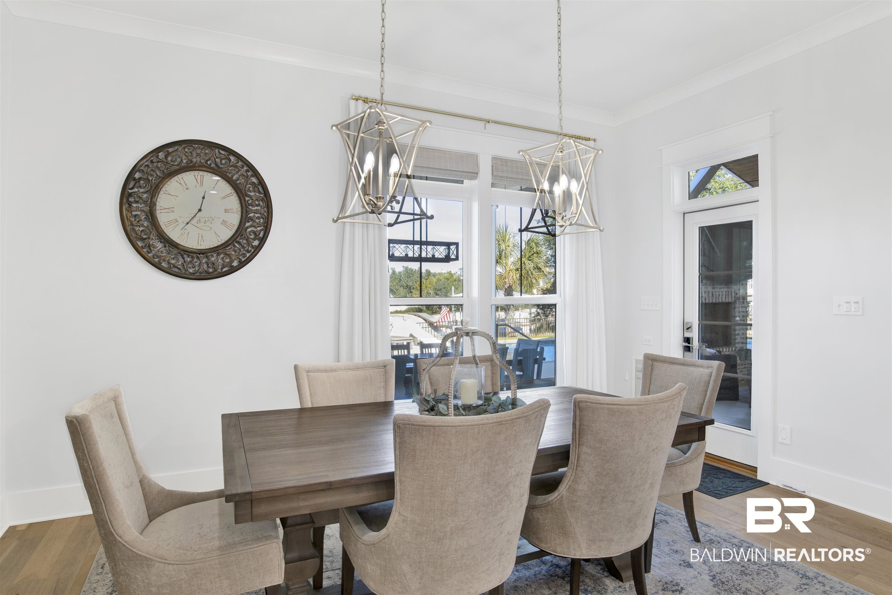 32937 River Road Orange Beach, AL 36561 - Photo 12 of 42 Dining room featuring dark hardwood / wood-style floors and ornamental molding