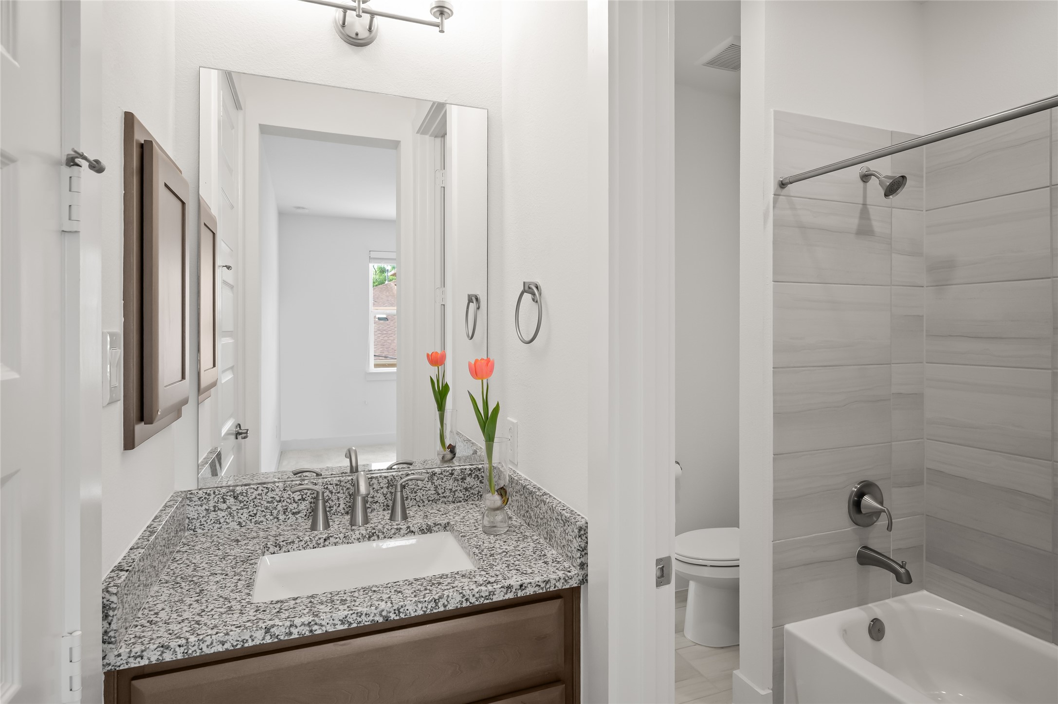 2215 MacArthur Street Houston, TX 77030 - Photo 24 of 33 a bathroom with a granite countertop sink and a mirror