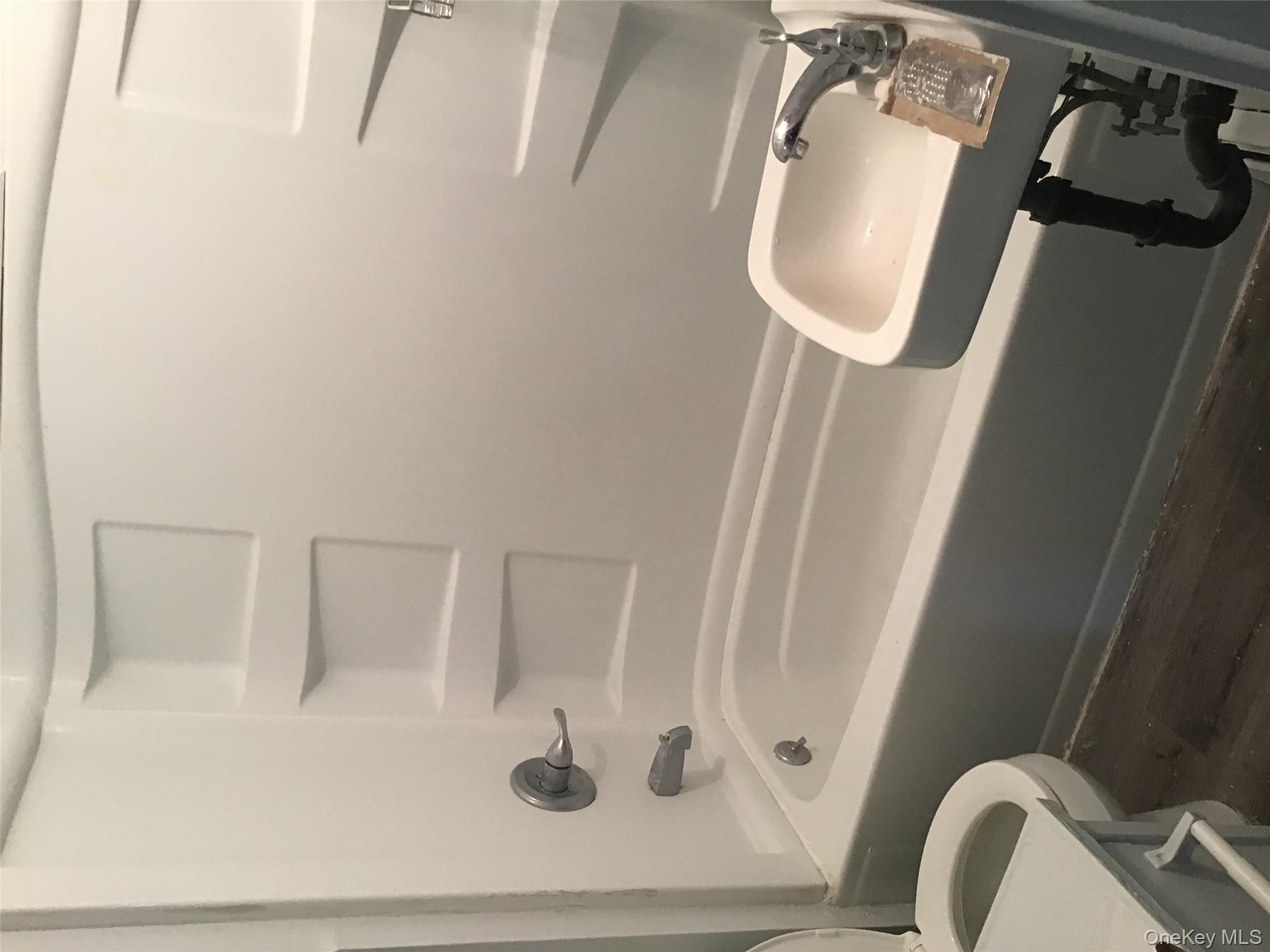 46 Benson Street West Haverstraw, NY 10993 - Photo 7 of 11 Bathroom featuring shower / washtub combination and dark wood-type flooring