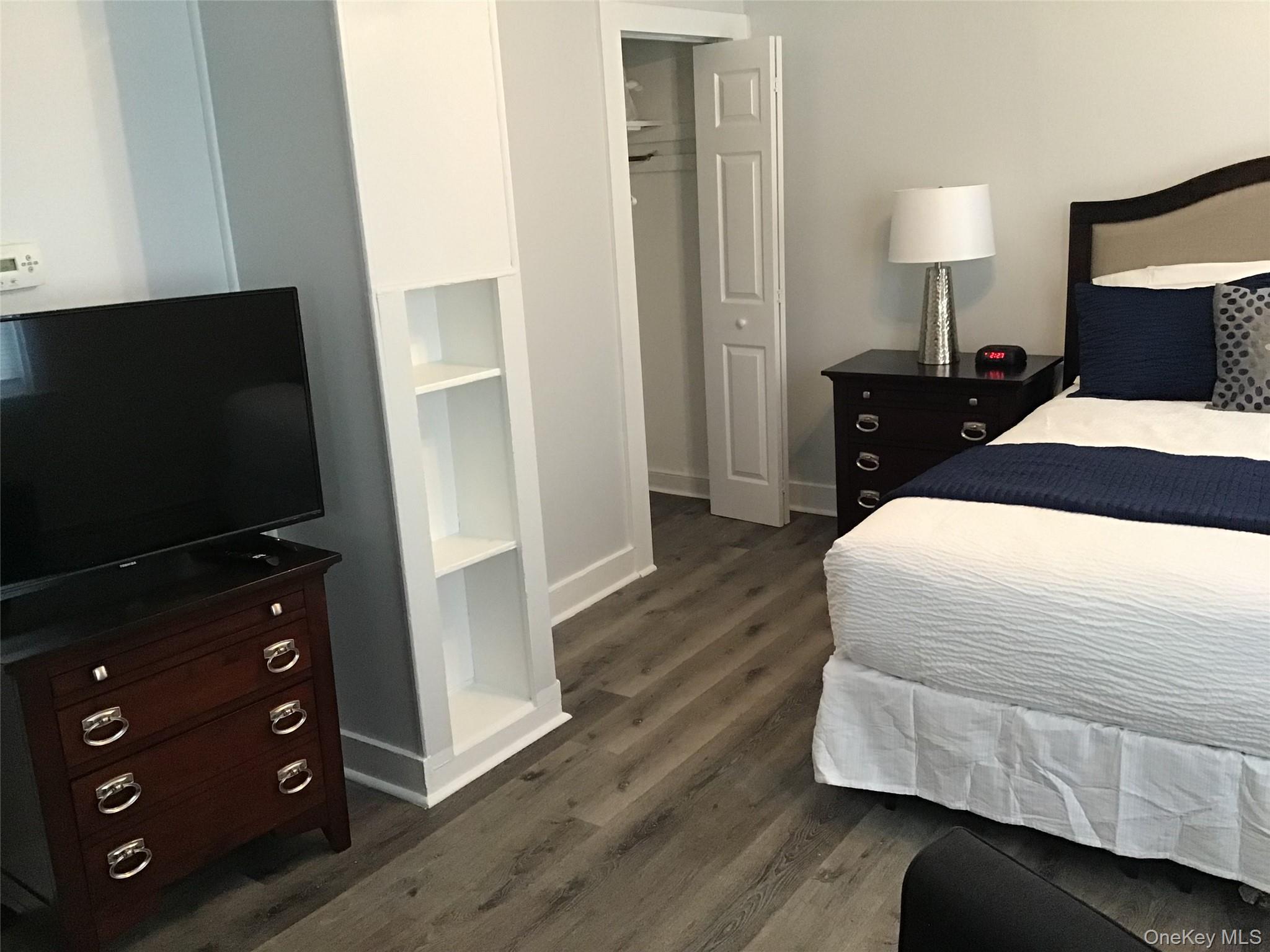 46 Benson Street West Haverstraw, NY 10993 - Photo 9 of 11 Bedroom featuring dark wood-style floors and a closet