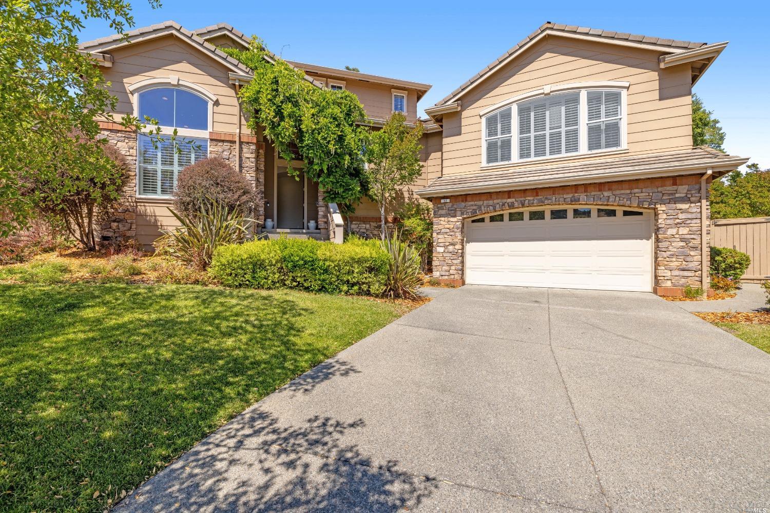 12 Jerome Court Petaluma, CA 94952 - Photo 1 of 1 a front view of a house with a yard and garage