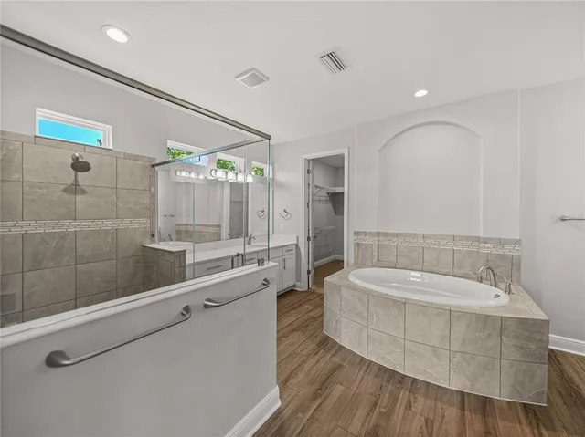 a bathroom with a sink a light fixture and a mirror