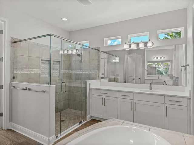 a bathroom with a toilet and a bath tub