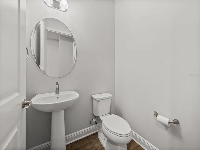 a view of an house with backyard space and garden