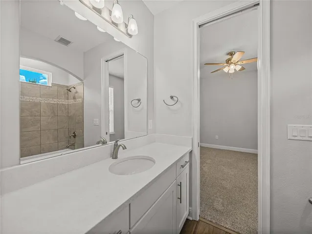 a view of a lake with houses in the back