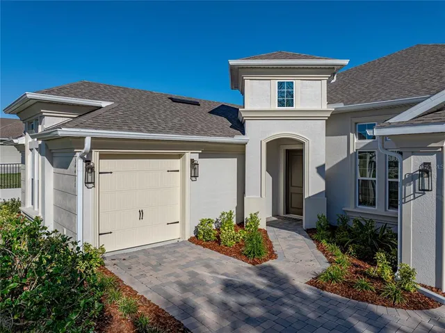 a large kitchen with granite countertop a large window a sink and stainless steel appliances