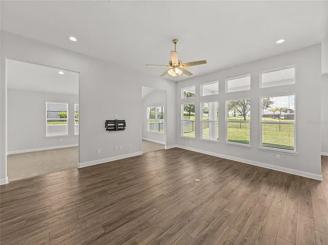 a view of kitchen with kitchen island stainless steel appliances refrigerator oven and stove