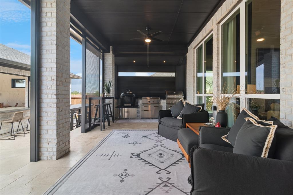 1920 Lotus Court Haslet, TX 76052 - Photo 26 of 40 Covered screened in porch off of dining area, kitchen, main living area. Fantastic cooking area at the end of the room with large Primo Smoker, DCS Griddle and DCS Grill.