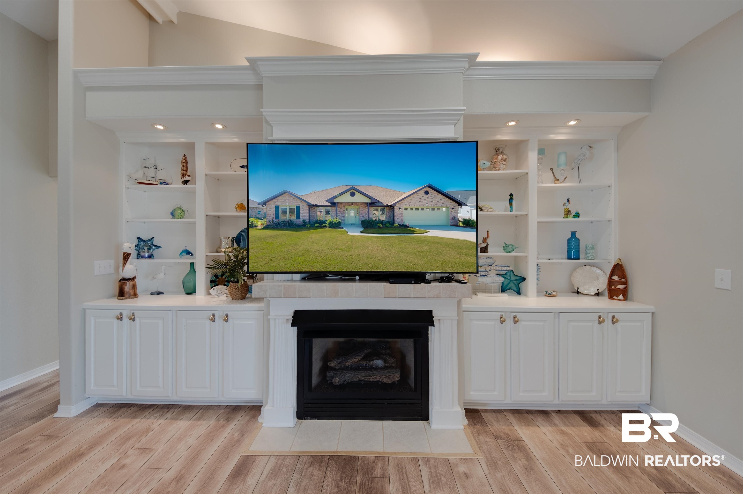 9462 Lakeview Drive Foley, AL 36535 - Photo 10 of 50 Unfurnished living room featuring light hardwood / wood-style floors, crown molding, built in features, and lofted ceiling