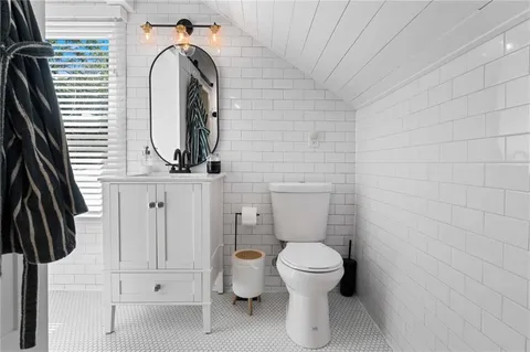 a bathroom with a toilet and a sink