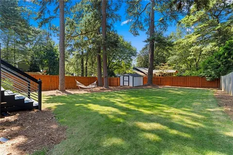 a view of a house with a yard porch and sitting area