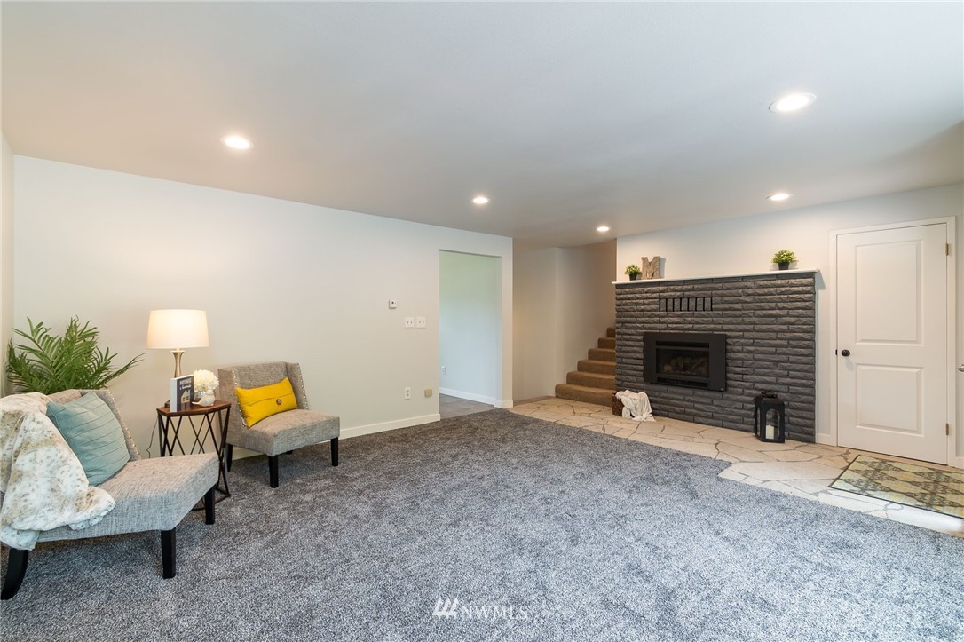 4086 Linnell Road Deming, WA 98244 - Photo 14 of 38 a living room with furniture and a fireplace