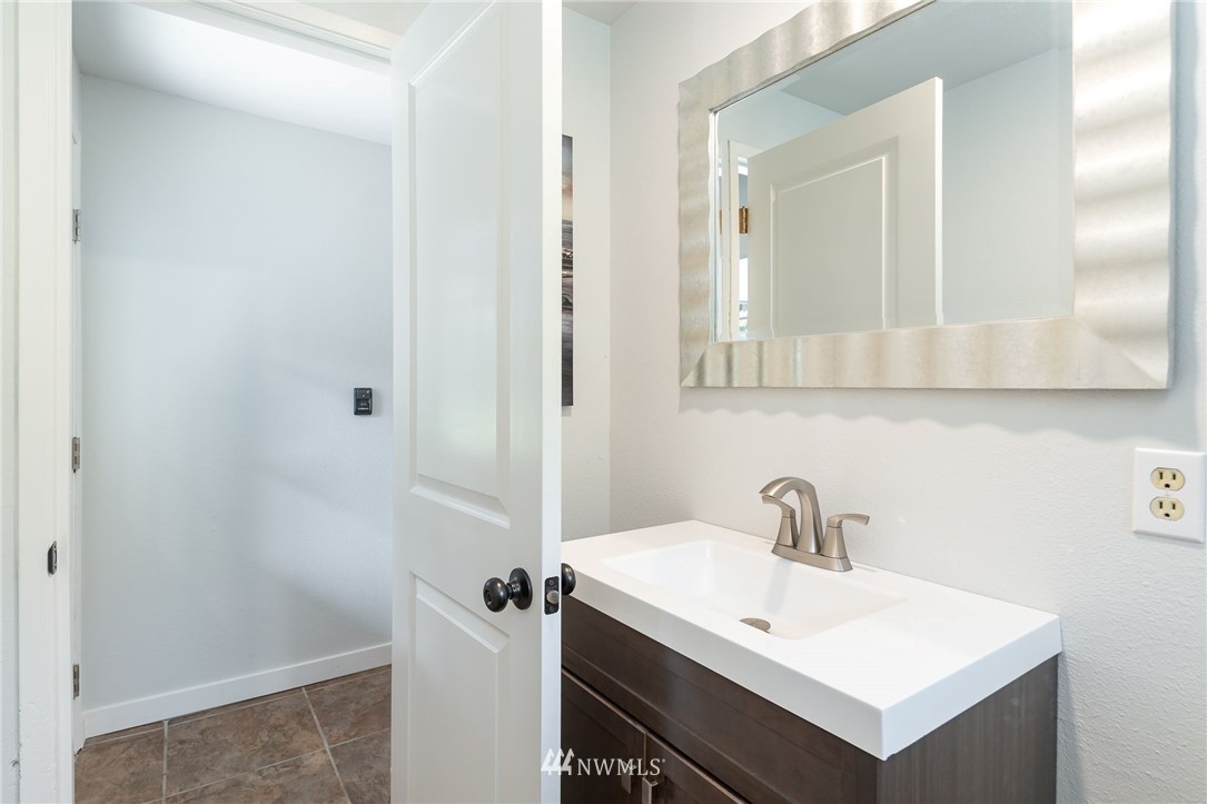 4086 Linnell Road Deming, WA 98244 - Photo 16 of 38 a bathroom with a sink and a mirror