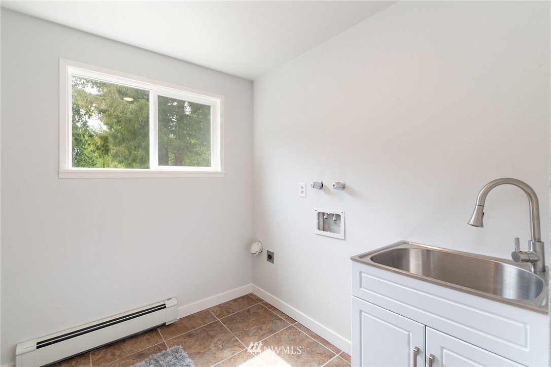4086 Linnell Road Deming, WA 98244 - Photo 17 of 38 a kitchen with a sink and large window