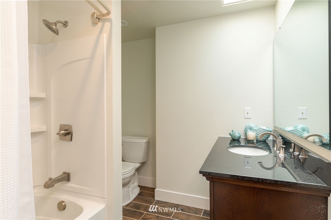 4086 Linnell Road Deming, WA 98244 - Photo 22 of 38 a bathroom with a sink and a mirror
