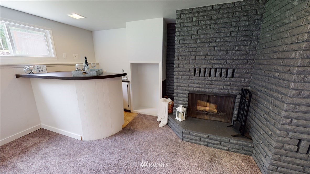 4086 Linnell Road Deming, WA 98244 - Photo 25 of 38 a view of empty room with a fireplace