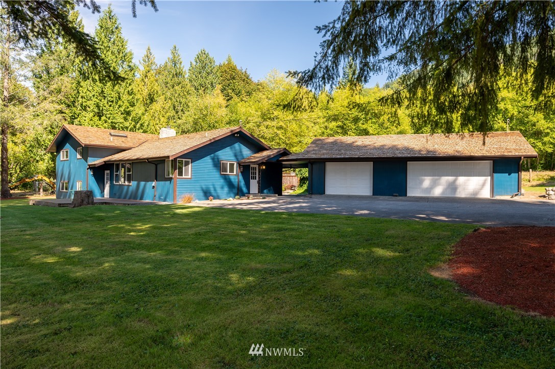 4086 Linnell Road Deming, WA 98244 - Photo 32 of 38 a front view of a house with a garden