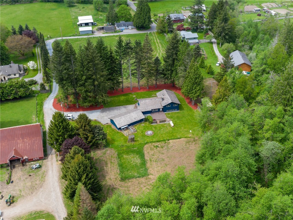 4086 Linnell Road Deming, WA 98244 - Photo 36 of 38 an aerial view of a house with a yard basket ball court and outdoor seating