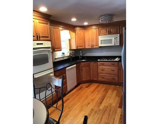 45 Chatham Road Billerica, MA 01821 - Photo 8 of 29 a kitchen with stainless steel appliances granite countertop a sink and a stove