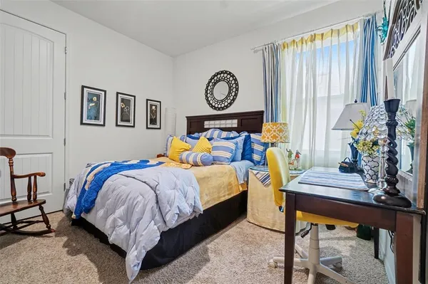 a bed room with bed and a window