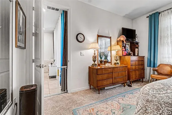 a room with furniture and a mirror