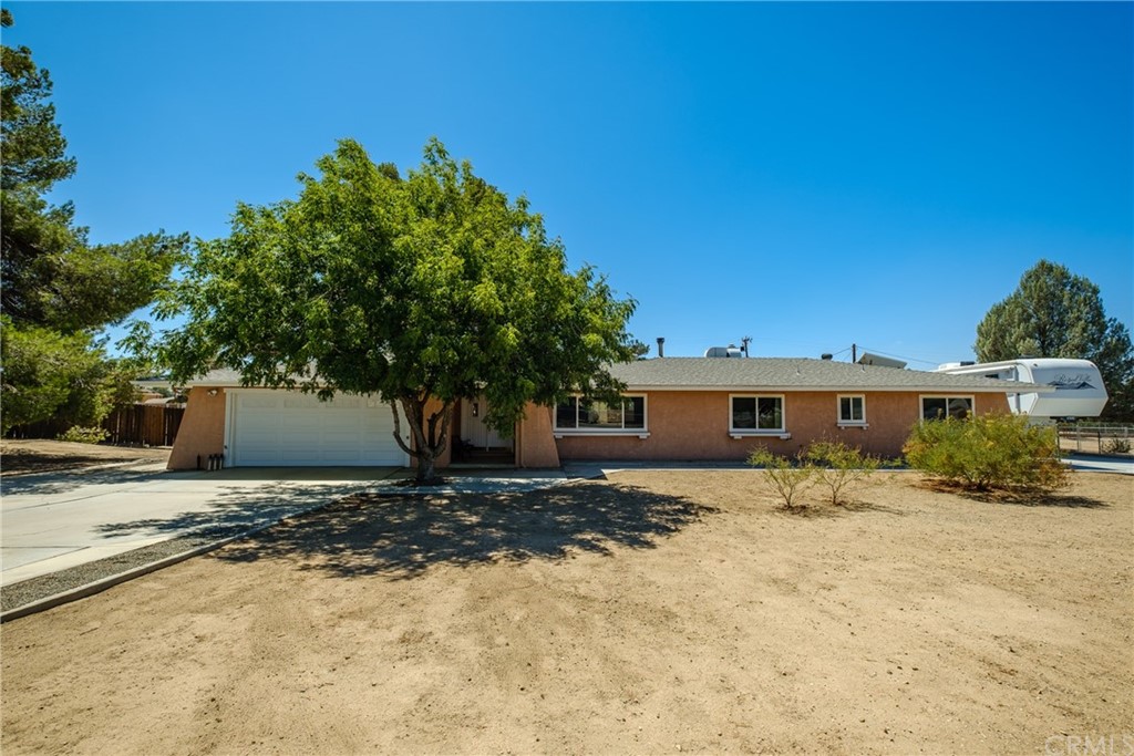15353 Mondamon Road Apple Valley, CA 92307 - Photo 1 of 1 a view of a house with a yard