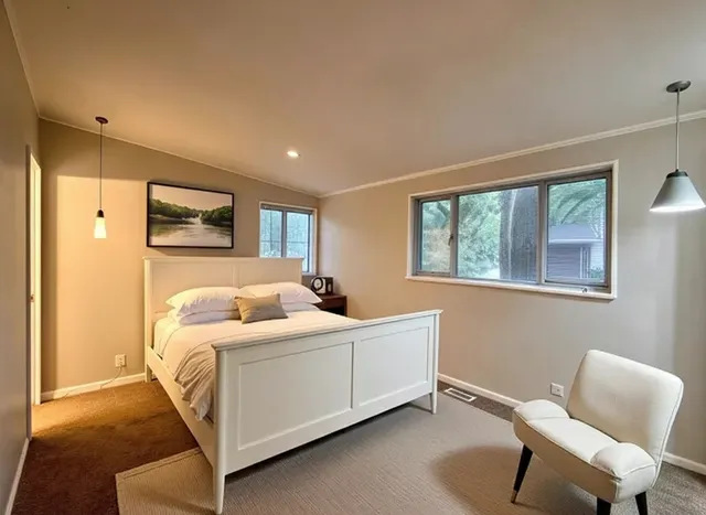 a room with a bed and a chair