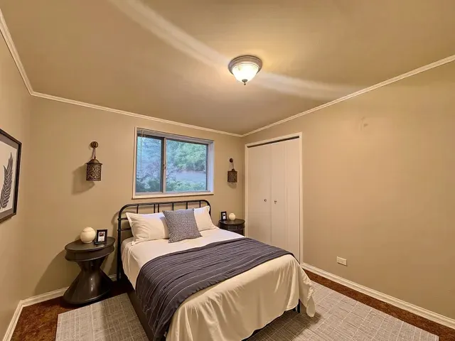 a bedroom with a bed and window