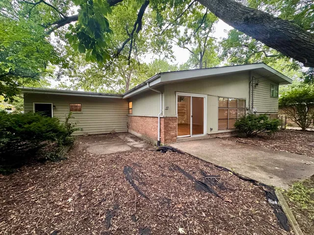 a backyard of a house with lots of green space