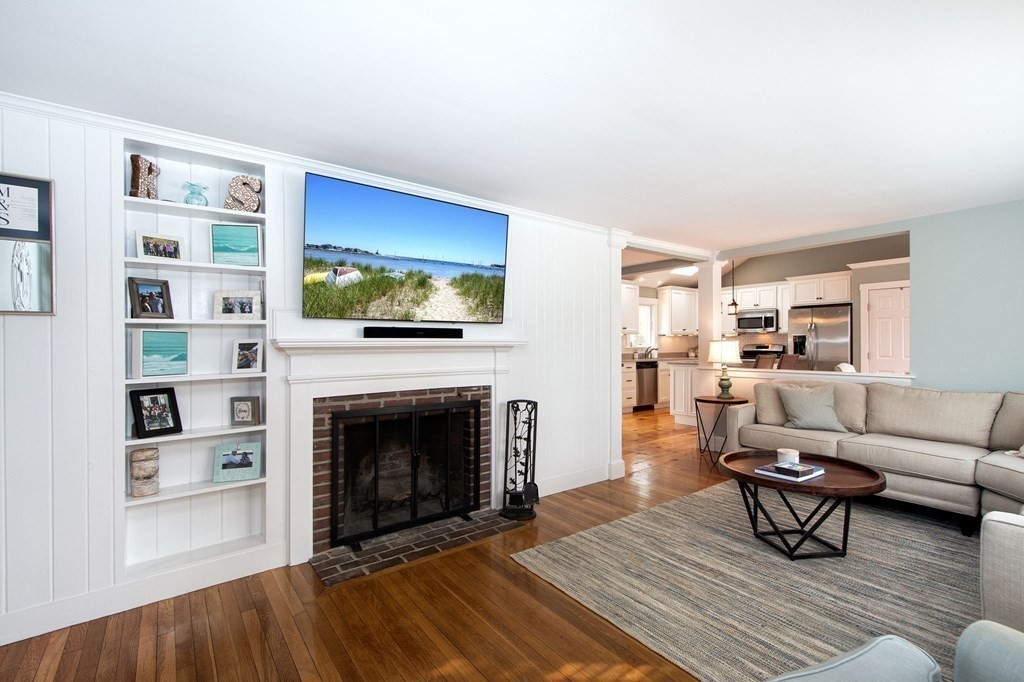 250 First Parish Road Scituate, MA 02066 - Photo 12 of 25 a living room with furniture and a fireplace