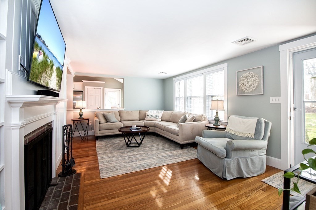 250 First Parish Road Scituate, MA 02066 - Photo 13 of 25 a living room with furniture wooden floor and a fireplace