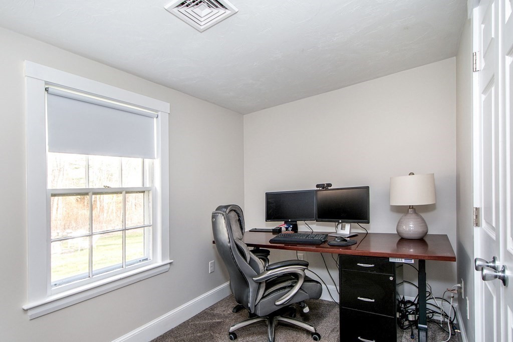 250 First Parish Road Scituate, MA 02066 - Photo 15 of 25 a view of a workspace with furniture and a window