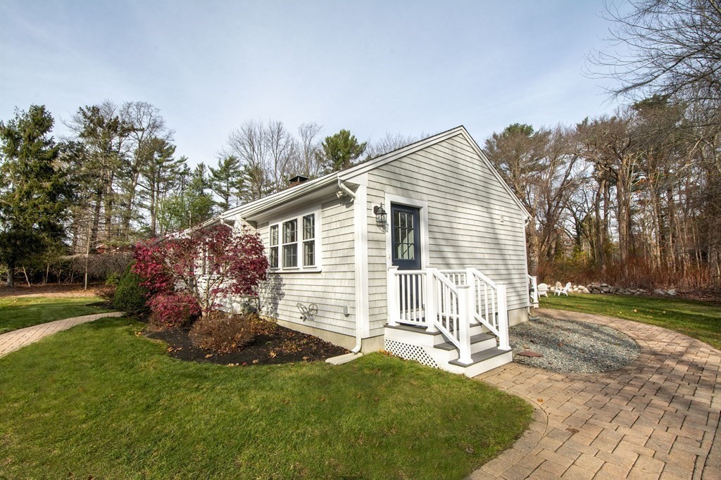 250 First Parish Road Scituate, MA 02066 - Photo 20 of 25 a front view of a house with a yard porch and outdoor seating