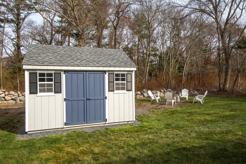 250 First Parish Road Scituate, MA 02066 - Photo 25 of 25 a backyard of a house with table and chairs