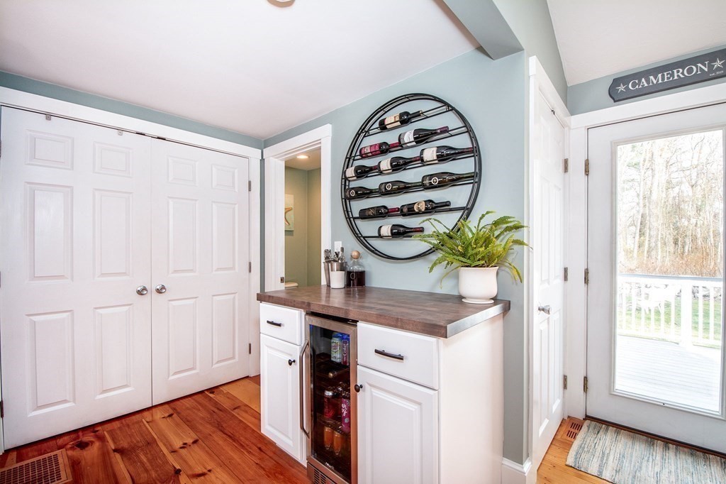 250 First Parish Road Scituate, MA 02066 - Photo 9 of 25 a view of a hallway with front door wooden floor and windows