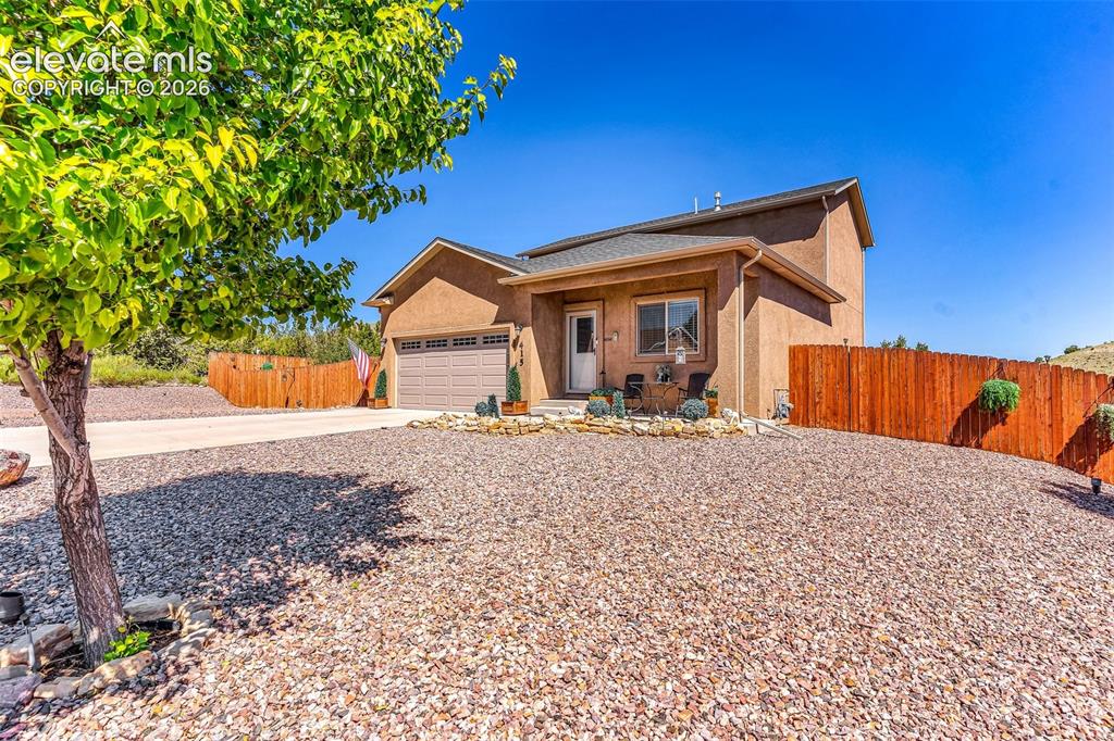 415 Empire Road Canon City, CO 81212 - Photo 3 of 40 a front view of a house with a yard