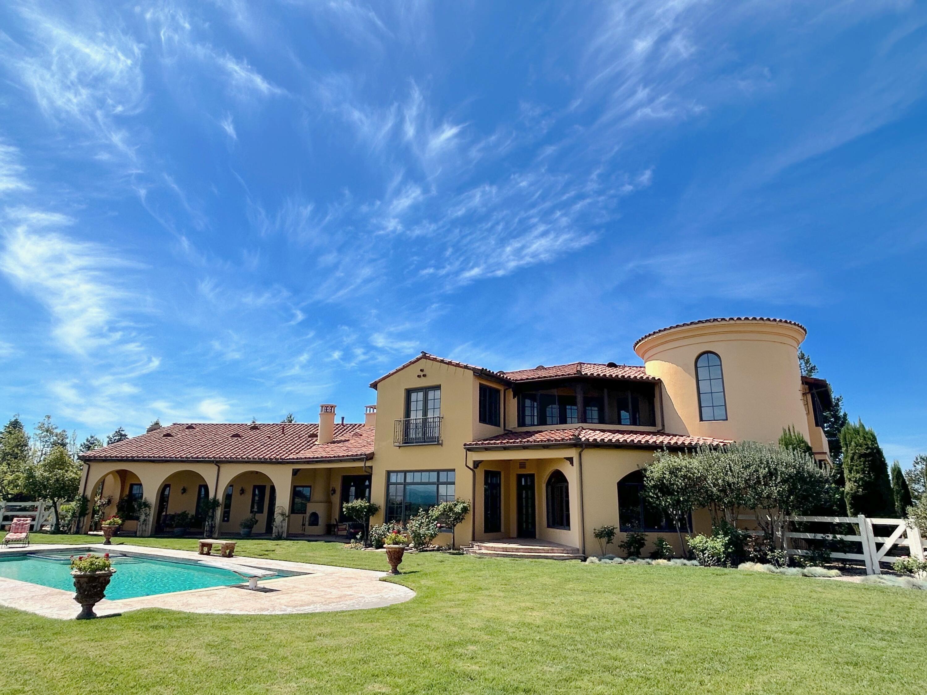 1910 Adobe Canyon Road Solvang, CA 93463 - Photo 1 of 3 a front view of a house with a swimming pool