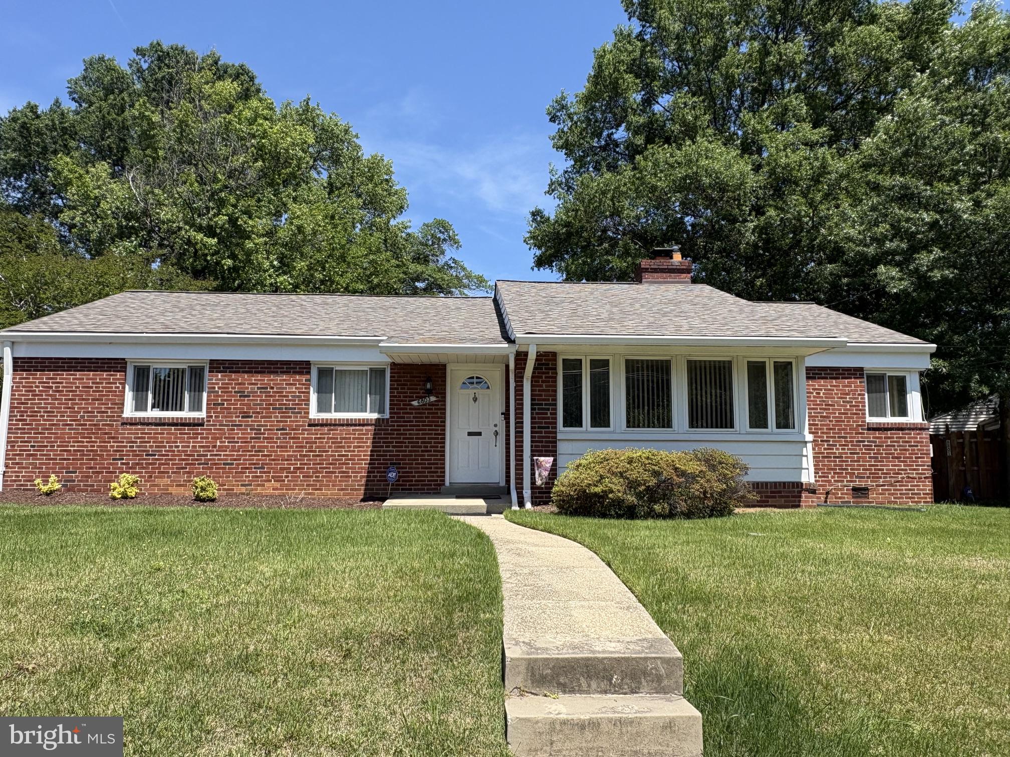 6803 Adelphi Road University Park, MD 20782 - Photo 2 of 55 Charming brick home with lush greenery.