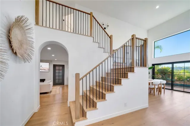 a living room with furniture a fireplace and a table