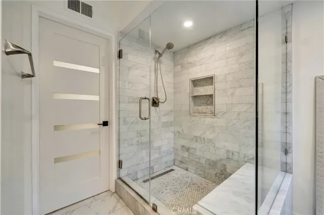 a bathroom with a granite countertop sink mirror and double