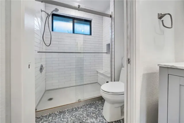 a bedroom with bed and a window